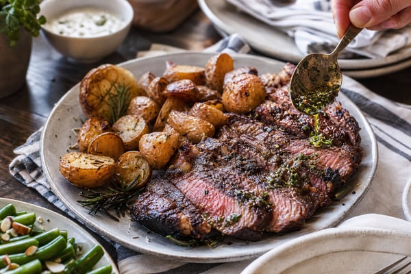 Golden Ribeye with Roasted Garlic Potatoes recipe from Heritage Fork Suppers